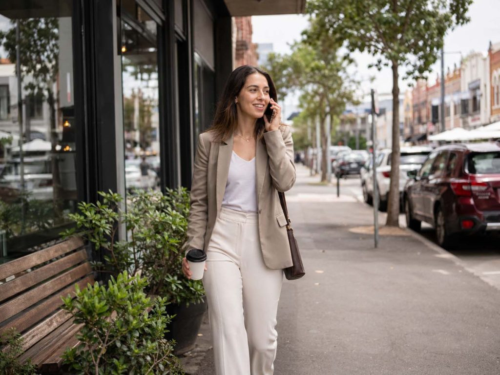 Business woman on the phone near South Melbourne Market representing SEO South Melbourne services for local businesses