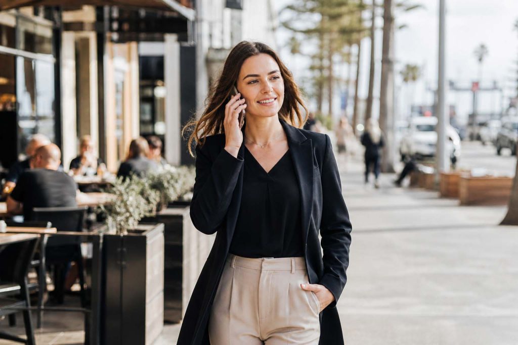 Professional woman on the phone near Frankston shops for SEO Frankston business marketing