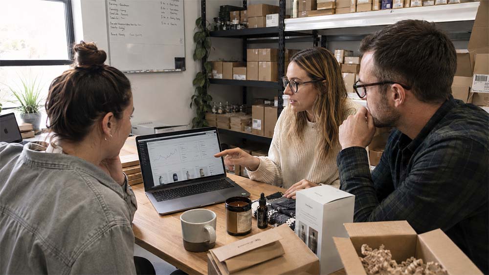Ecommerce business owner checking product page SEO, sales data and organic traffic from a laptop