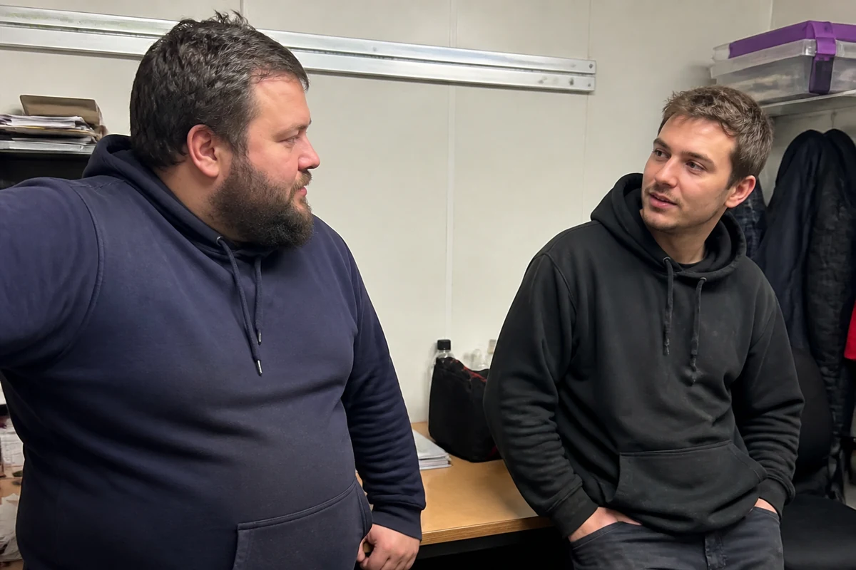 Electrical team discussing customer enquiries, service pages and local SEO in a business workspace