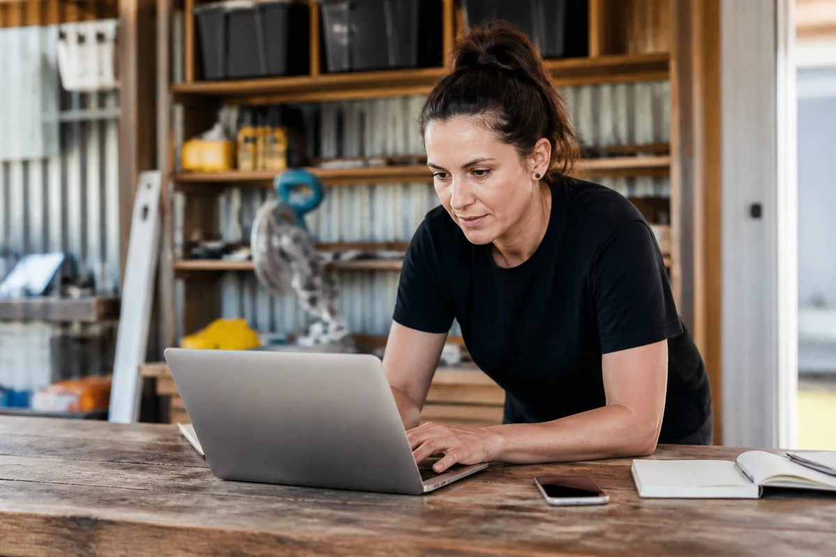 Professional business owner reviewing online visibility and enquiry opportunities for tradies businesses
