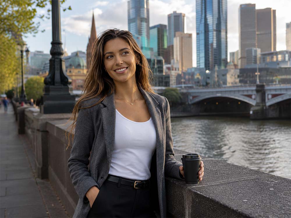Woman business owner enjoying her SEO Melbourne campaign results in the CBD along the Yarra.