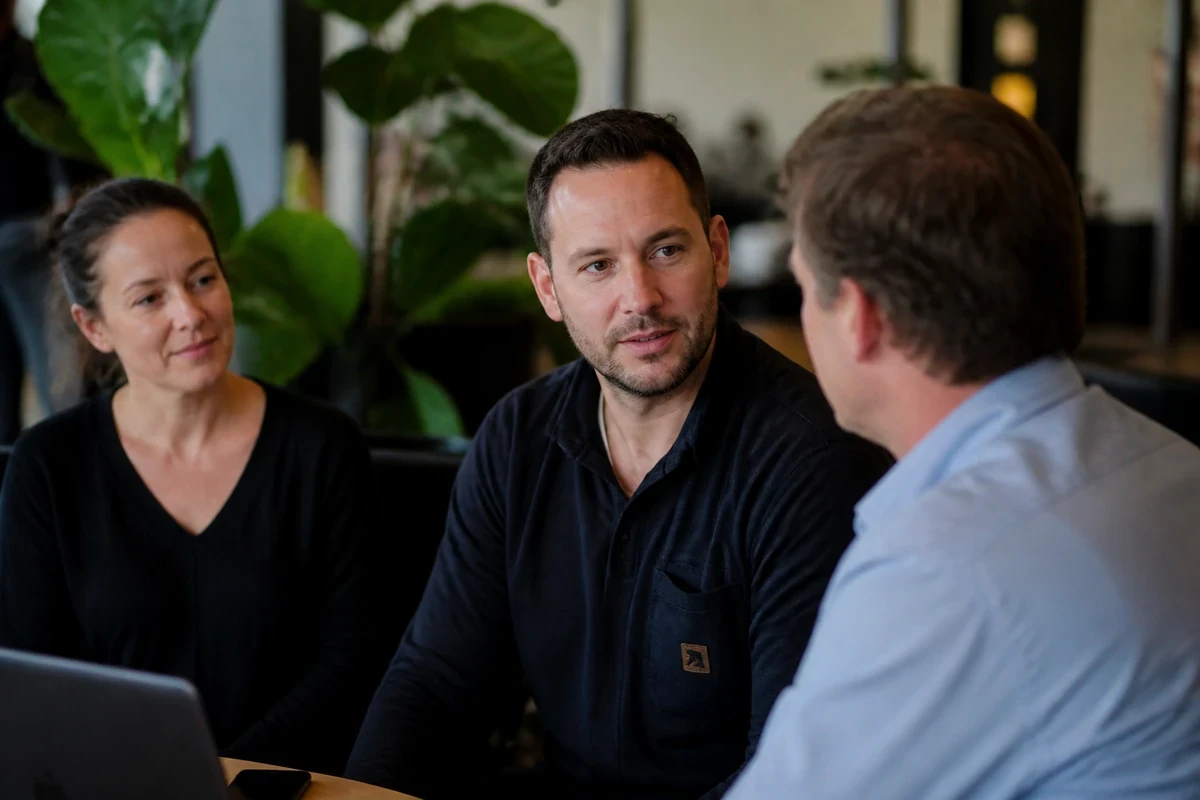 Wollongong service business owners discussing website planning in a relaxed cafe meeting